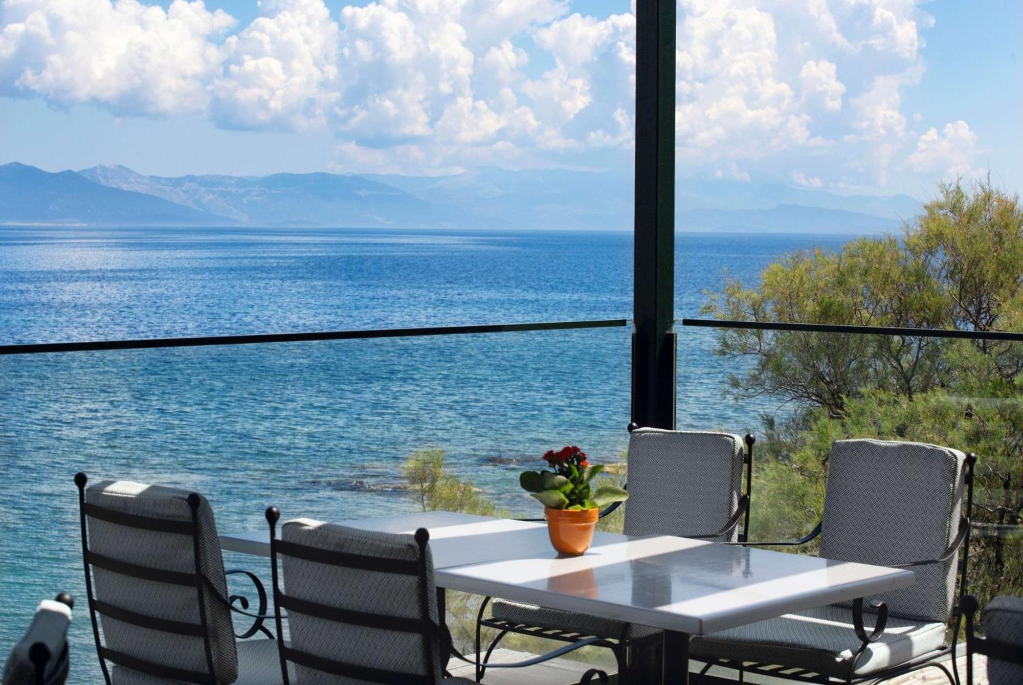 Ramada By Wyndham , Athens Club Attica Riviera Hotel Mati Exterior photo View of the Gulf of Corinth from the balcony of a house in Limenas