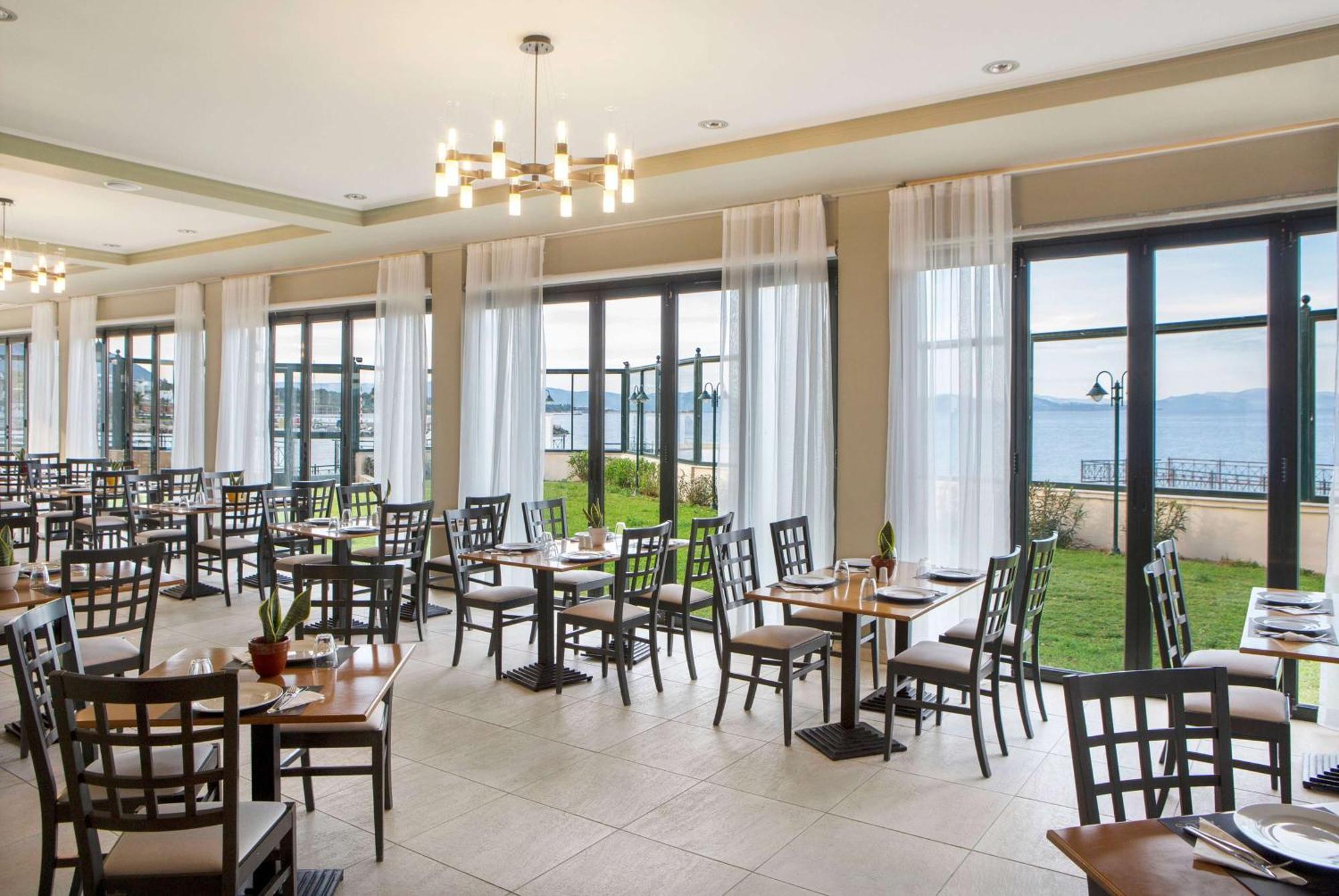 Ramada By Wyndham , Athens Club Attica Riviera Hotel Mati Exterior photo Restaurant